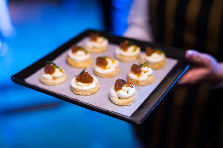 mini cracker canepe appetizer serve on wooden platterの写真素材