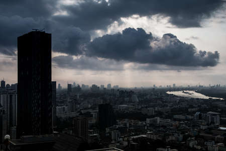 Giant clouds cover over the city and riverの写真素材