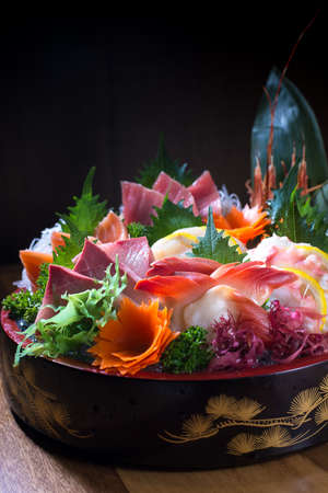 Bowl of variety fine japanese sliced seafood in restaurantの写真素材