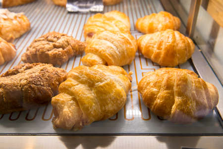 Croissant and chicken pie in displayの写真素材
