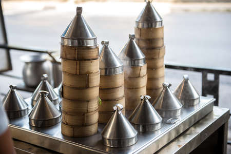 Dim sum kitchen with a lot bamboo steamersの写真素材