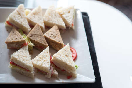 Hotel Coffee break  cold cut platter ham cheese sandwich trianglesの写真素材