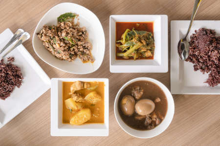 Thai dish eat with rice red curry , larb and egg stewの写真素材