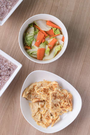 Thai omelet and stir fried chinese cabbage with sweet carrotの写真素材
