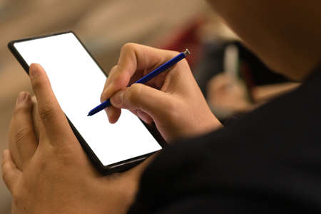 people write something on the phoneの写真素材