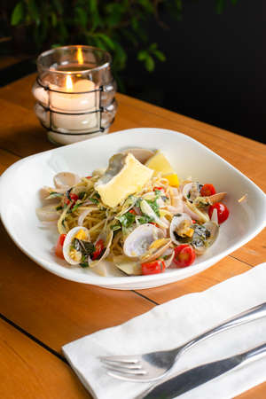 delicious clams spaghetti topped with cheeseの写真素材