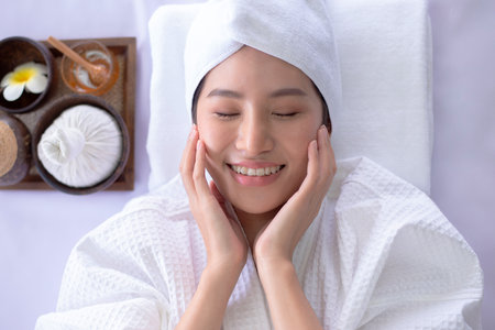 asian lady relaxing on spa treatment programsの写真素材