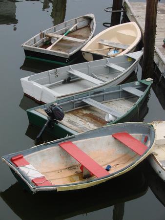 A group of dinghies at the fishing pierの写真素材