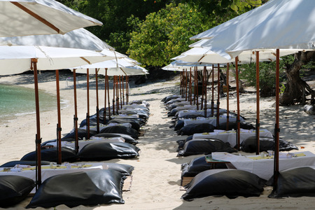 White umbrella and air cushion seat on the beach in Thailand.の写真素材