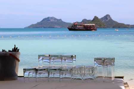 Glass and beverage on the beach.の写真素材