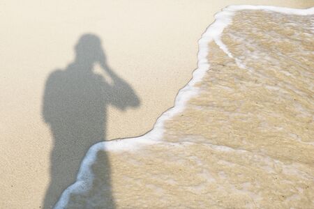 Sand shadow, and photographerの写真素材