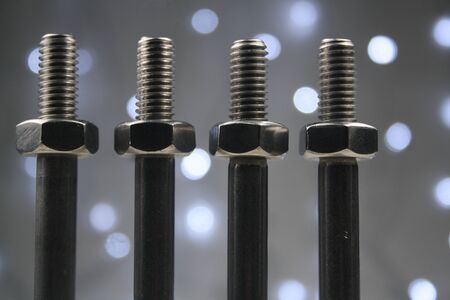 Nuts and Bolts with light background.の写真素材