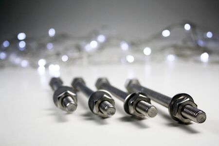 Nut and Bolts with light background.の写真素材