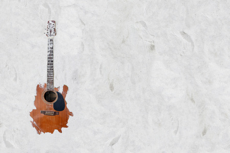 The guitar in the sand on the beach.の写真素材