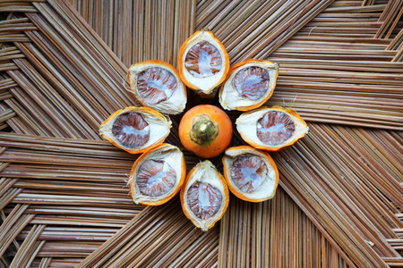 betel nut in the coconut leaves basket.の写真素材