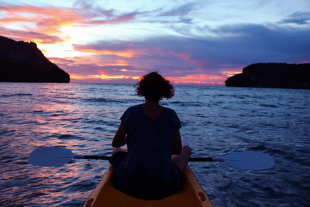 Women looking sunset on kayaking between the Islands at angthong National park.の写真素材