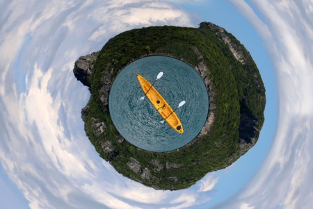 The circle image of the island sea and sky with kayaking.