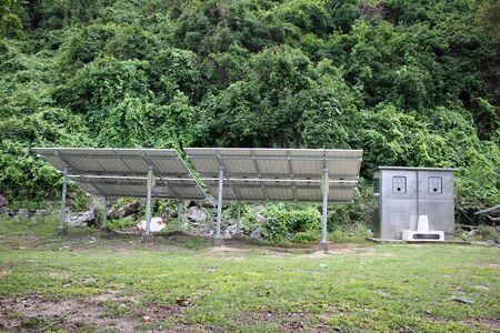 The structure and components of a solar power system on the forest edge.