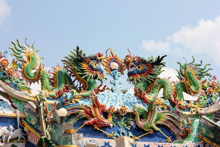 Dragon statue on the roof of a Chinese temple.の写真素材