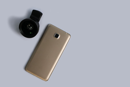 Clip lens for connect with mobile phones in white background.の写真素材