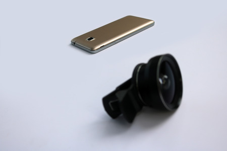 Clip lens for connect with mobile phones in white background.の写真素材