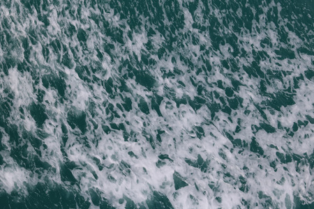 Sea water surface ,wave and bubbles in the ocean,Nature background