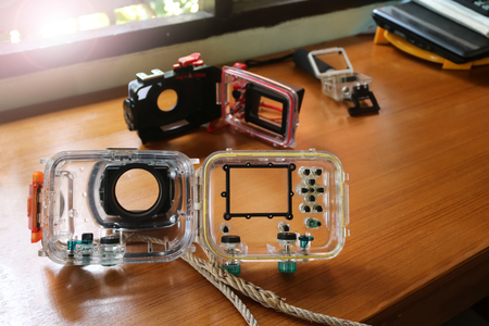 Waterproof Underwater Housing or Case box for a different camera on wooden backgroundの写真素材