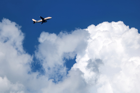 Airplane in the sky with white clouds and blue sky at samui island Thailand.の写真素材