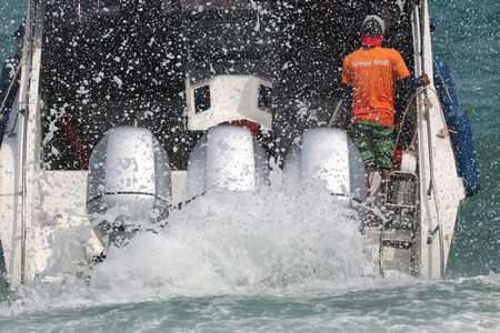 Speed boat engine is runing with sea water splashing Gulf of Thailand.