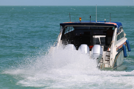Speed boat engine is runing with sea water splashing Gulf of Thailand.の写真素材