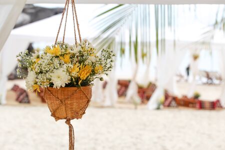 Hanging flower vase decorated at the beach garden.の写真素材