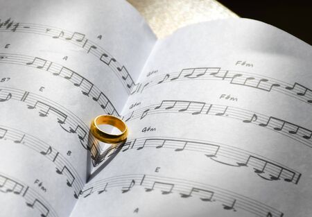 Symbol of love concept, Ring on the song books music notes.の写真素材