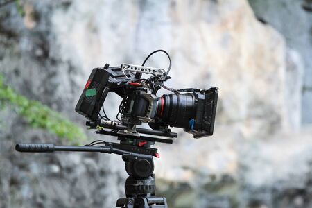 Videographer are shooting on the top of the mountain, Nature views background.