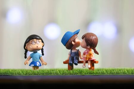 Photos taken by gesturing dolls or toys. Showing love in the natural garden.の写真素材