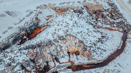 Snow covers this rock quarry but it still shows activity regardless of seasonの写真素材