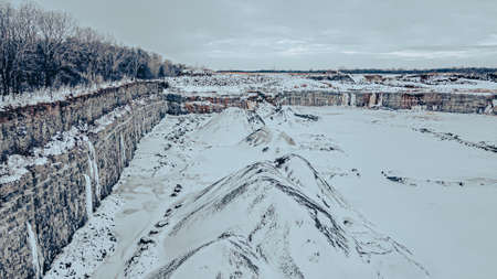 Snow covers this rock quarry but it still shows activity regardless of seasonの写真素材