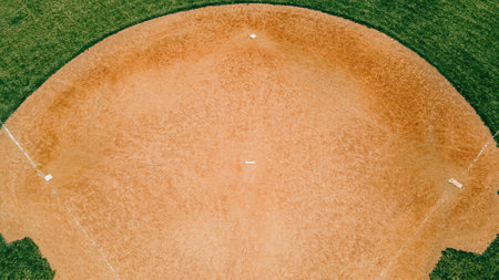 Fresh grass grows in the spring around the baseball fields at a local park.の写真素材