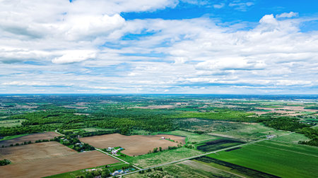 Rural Wisconsin Landscape in Springtime with farm lands, meadows, fields, and forests all to the horizonの写真素材