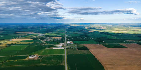 A view of the countryside of wisconsin during the summer with country roads and farmsの写真素材