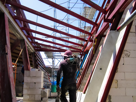 The building is under construction, roof steel frame for building construction, large steel frame.
