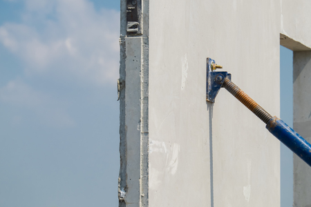 steel use for cling on the precast concrete wall, Installation of prefabricated house.の写真素材