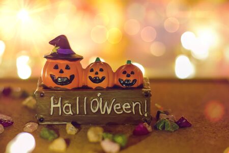 Jack O Lantern Halloween Pumpkin bright with bokeh effect background, bokeh light, Halloween background, holiday celebration.の写真素材