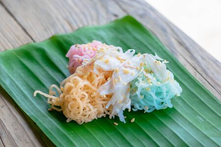 Thai Desserts (Ka-Nhom-Ray-Rai or Rang-rai ), Rice flour dumpling topped coconut milk and sugar mixed with sesame, colorful Thai desserts, Thailand traditional food.の写真素材