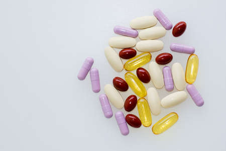 Multivitamins and supplements on white background, Including Vitamin c, vitamin E, fish oil...