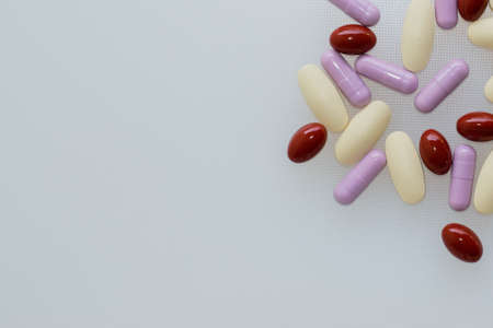 Multivitamins and supplements on white background, Including Vitamin c, vitamin E, top view.の写真素材