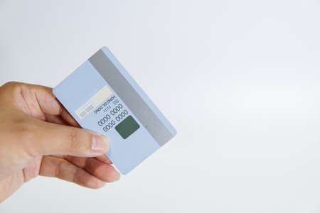 a hand holding a credit cardの写真素材