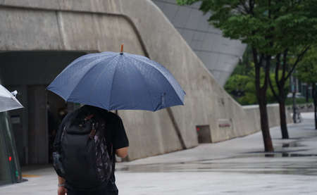 a picture of a man with an umbrellaの写真素材