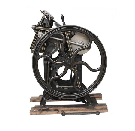 a black 1901 printing press with gold trim, isolated