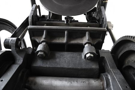 a 1901 printing press showing bolts, gear and inking disc against a white backgroundの写真素材