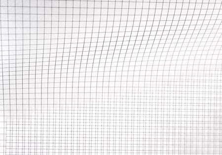 two sheets of graph paper, one curving, one notの写真素材